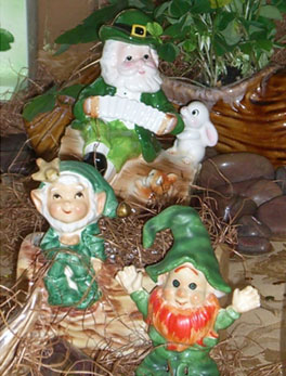 porcelain leprechauns on straw